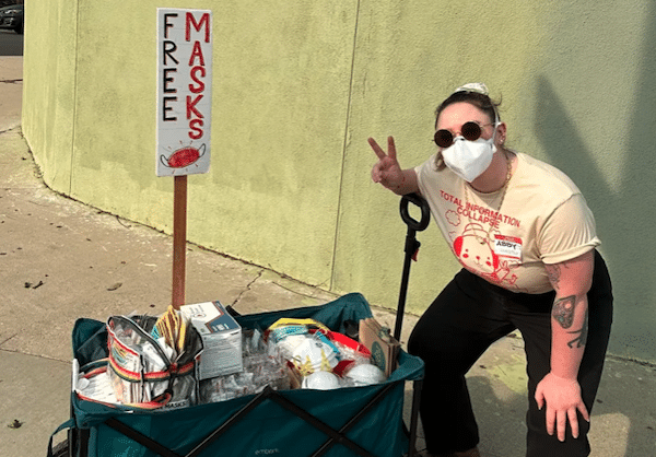 | Mask Bloc LA member Abby Mahler poses with a wagon full of free high quality masks Image via Abby Mahler | MR Online